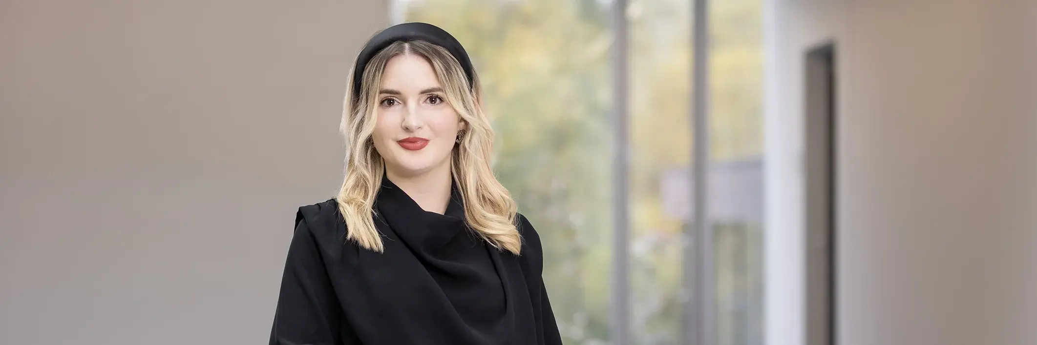 A portrait of Alina Hafner.