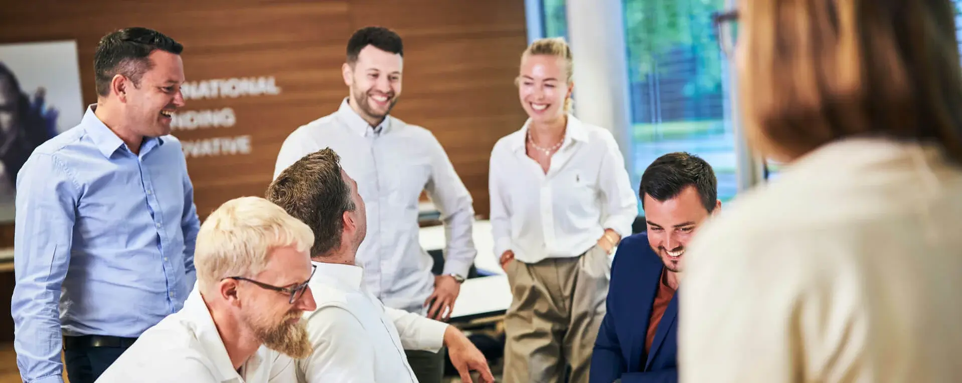 Colleagues in discussion during a meeting