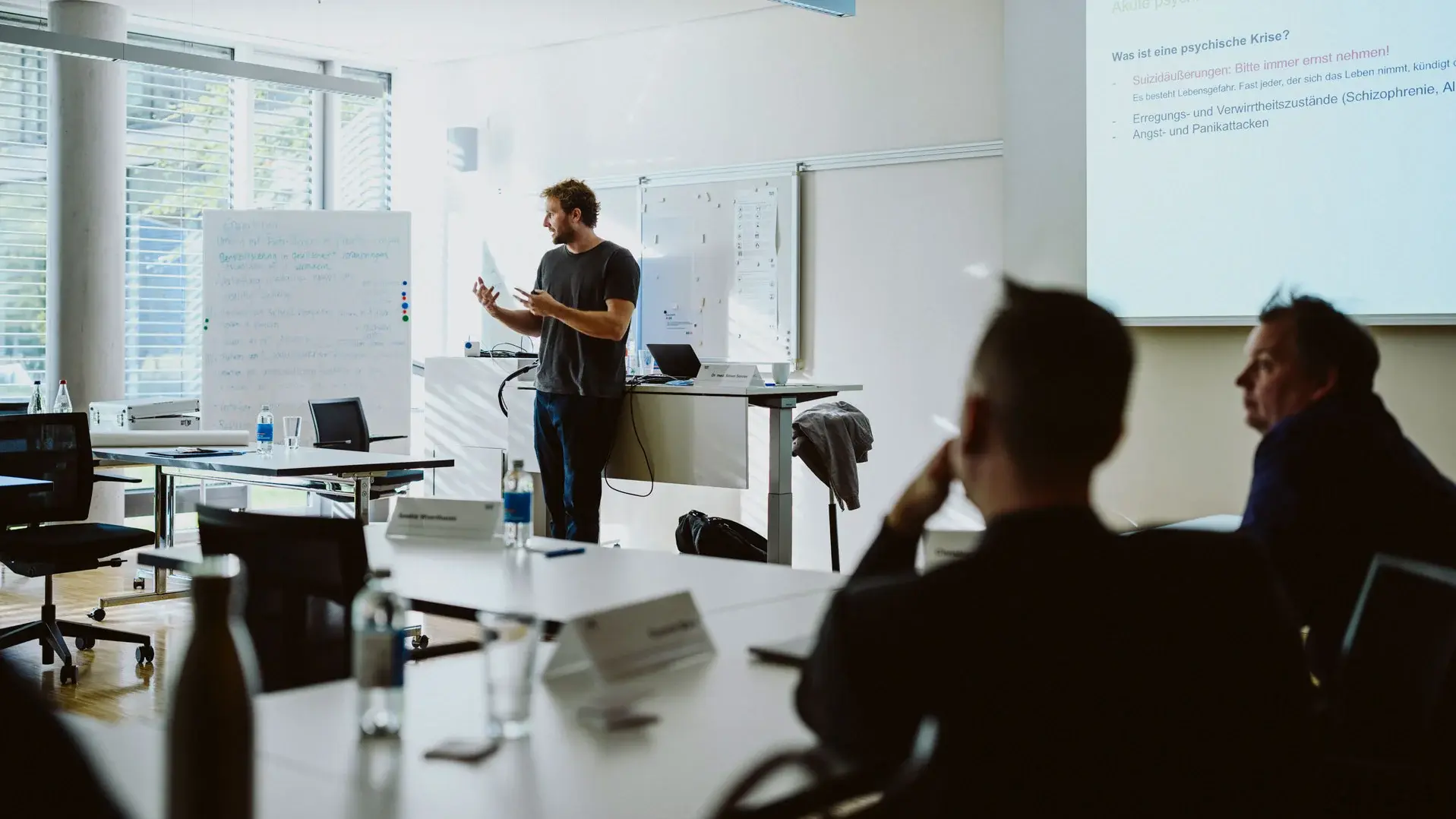 Lecturer presenting to students in classroom